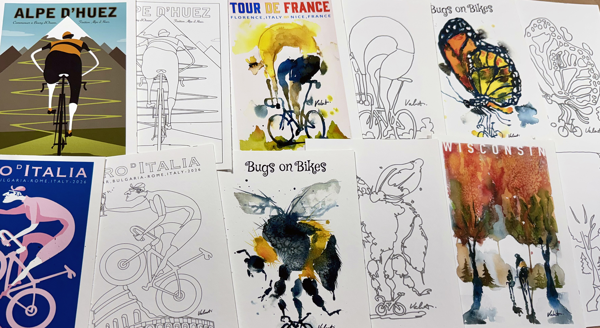 MiniPrints_wOutlines_2000x1092 - Michael Valenti Row of cycling-themed posters with illustrated and watercolor bike art, including Tour de France and Alpe d'Huez covers.